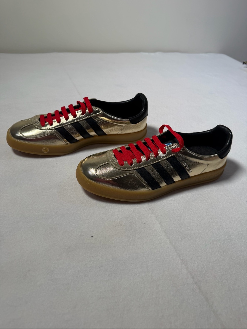 Gucci Metallic Gold Sneakers with Black Stripes and Red Laces - Picture 3 of 8